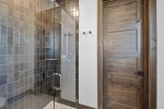Gorgeous tiled shower and walk in closet
